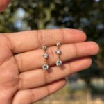 Triple Solitaire Drop Earrings - Image 2